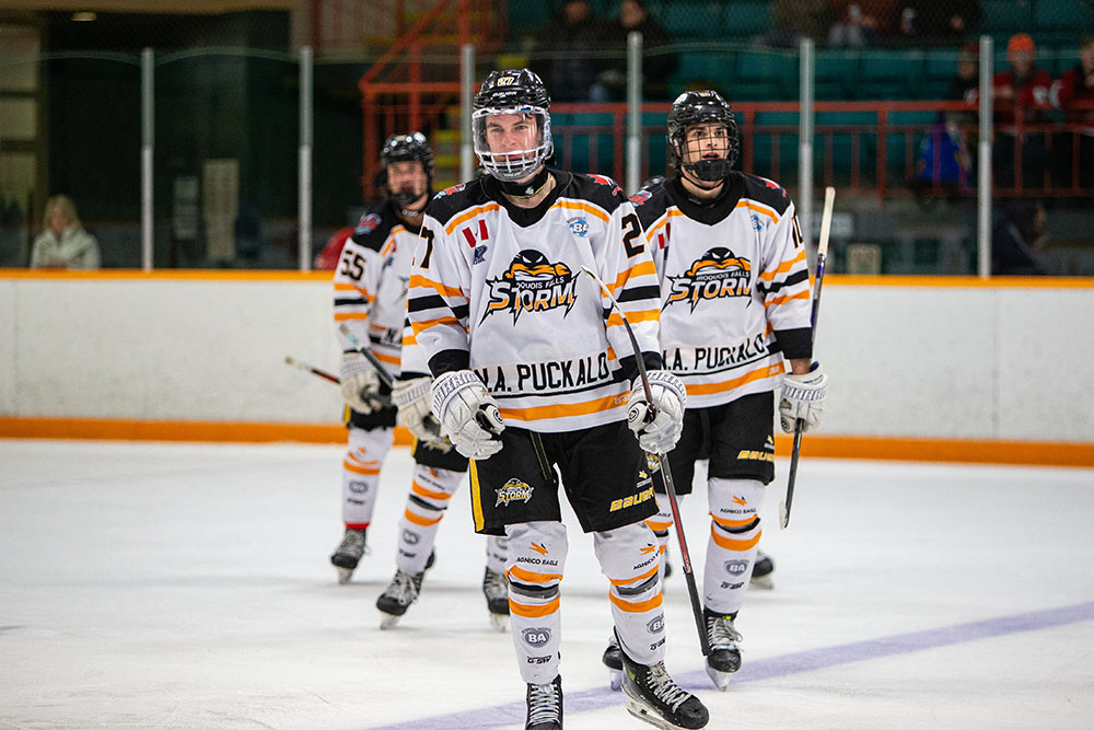 Iroquois Falls Storm players skate to bench