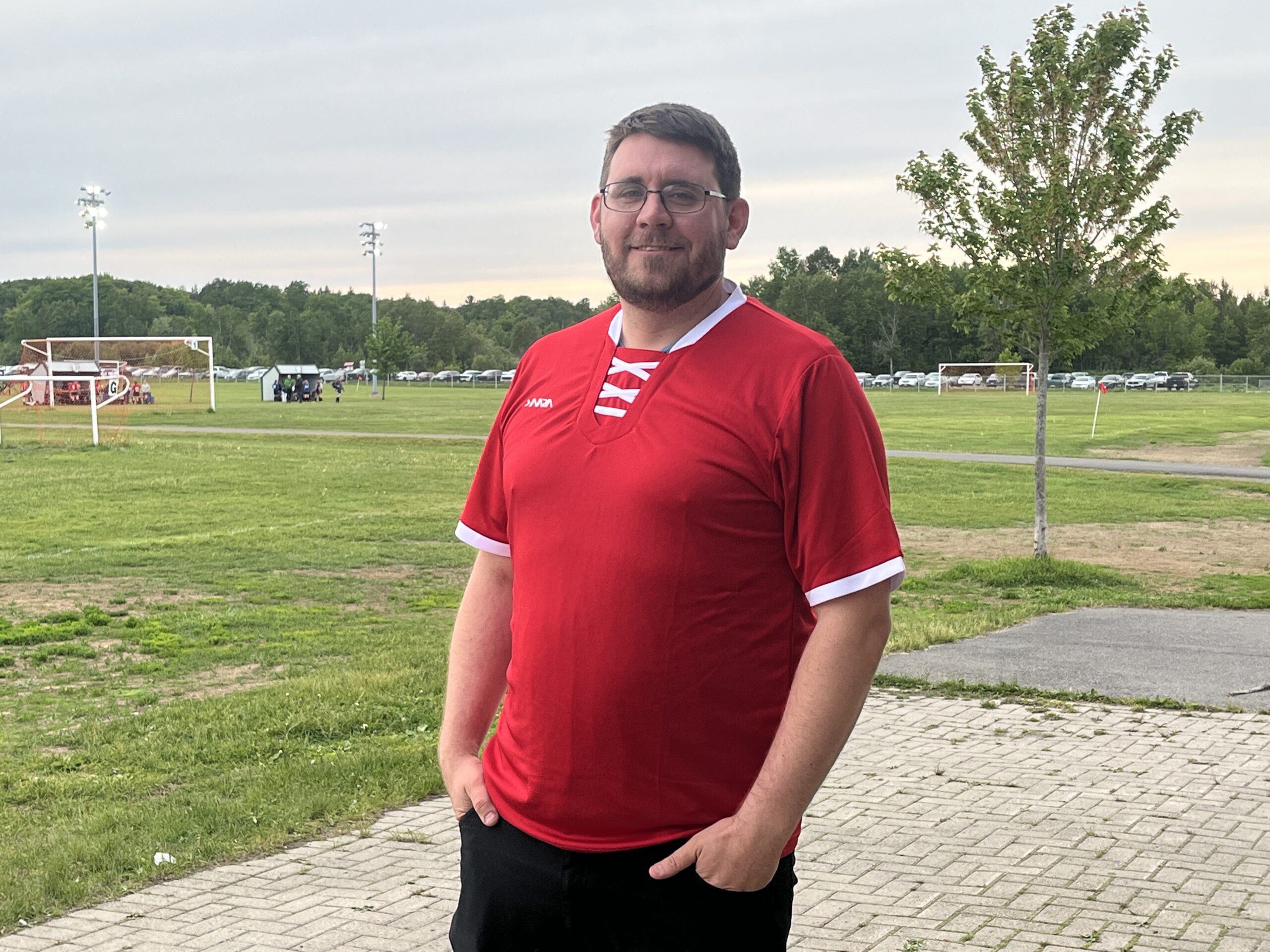 COACH'S SPOTLIGHT | Tim Marsh: From the sidelines to the soul of the game 30 Tim Marsh poses with a red jersey on